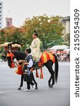 Small photo of Kyoto, Japan - October 22, 2007: Actor representing a Asano Nagamasa, the brother-in-law of Toyotomi Hideyoshi on horseback, the member of Toyotomi Hideyori retinue. Jidai Festival. Kyoto. Japan