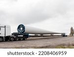 Small photo of Wind turbines under construction. Transport of a Blade for wind turbines. Special transport of a blade for a wind turbine on a special semi-trailer in Rhineland Palatinate, Worrstadt, Germany, Europe