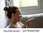 Small photo of Portrait of cheerful excited pregnant female smiling broadly speaking to her best friend on mobile.Pregnant girl talking on phone.Joyful positive woman being in a good mood while talking on smartphone