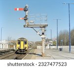 Small photo of Barrow-in-Furness, UK - 15 April 2023: A passenger train (Class 156) arriving Barrow station.