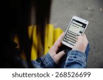 Girl dials sms message on mobile phone
