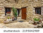 Small photo of Facade of a typical house made of stone in the mountains of Catalonia, Beget, Girona.