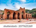 Small photo of ancient grand mosque called Adhai Din Ka Jhonpra vintage architecture with devotee visiting at day image is taken at Adhai Din Ka Jhonpra at ajmer rajasthan india on Aug 19 2023.