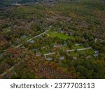 Aerial view of the countryside in Stormville, New York on a cloudy day during the colorful autumn season.