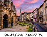 Arles Old Town and roman amphitheatre, Provence, France in dramatic sunset light