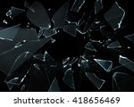 Shattered and broken glass pieces isolated on black
