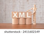Small photo of There is wood cube with the word XML. It is as an eye-catching image.