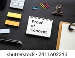 Small photo of There is notebook with the word Proof of Concept. It is as an eye-catching image.