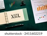 Small photo of There is notebook with the word XML. It is as an eye-catching image.