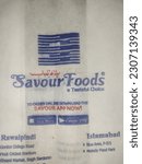 Small photo of RAWALPINDI, PAKISTAN - May 21, 2023: Famous brand Savour Foods made a new non plastic eco friendly bag for online order customers.