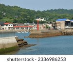 At the center of this image there is a breakwater lighthouse at the entrance
of a Japanese fishing port.
During low tide, the bases of the breakwaters are visible.

