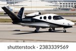 Small photo of Long Beach, CA - Oct 13 2023: A Private Cirrus Vision SF50 G2+ Arrivee jet on the taxiway of Long Beach airport.