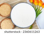Small photo of Selective focused image of fermented batter for idli and dosa in an isolated background. Idly and dosa batter in a bowl for fermentation, used to prepare the dosa and idli.