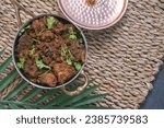 Small photo of Sukha mutton or chicken, dry spicy Murgh or goat meat served hot,  mutton fry, special hot spicy traditional dish. Buffalo roast, meat pepper fry. Top view South Indian non veg food side dish Rice
