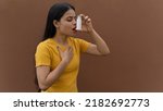 Small photo of Asthmatic patient catching inhaler having an asthma attack. Young woman having asthma, chronic obstructive pulmonary disease