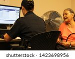 Small photo of San Luis, Ariz. / US - September 29, 2010: Regular border crossers apply to SENTRI, a pre-checked security pass to save people time, as Customs and Border Protection officers stand for questions. 8820