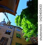 Small photo of Old lamp and chestnut tree on Branda Tomten in the old town of stockholm