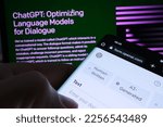 Small photo of Ai Text Classifier software webpage seen on smartphone screen and ChatGPT page on the blurred background. Tool for AI written text detection by OPEN AI. Stafford, United Kingdom, February 2, 2023
