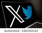 Small photo of X social media platform logo with old Twitter bird logo seen on laptop. Concept. Stafford, United Kingdom, October 29, 2023
