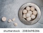 Small photo of Kurut (kurt) cheese - traditional Asian cheese made from sheep's, goat's or cow's milk. Kazakh and Kyrgyz national food. white salty balls from dry cheese close-up. Selective focus, copy space