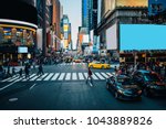 Famous Times Square landmark in New York downtown with mock up billboards for advertising and commercial information content. Big metropolis urban scene with development infrastructure with Lighboxes