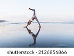 Small photo of Caucaisan woman in sportive track suit standing in yoga pose breathing and enjoying recreation outdoors, beautiful female practice hatha feeling inspiration and balance in asana keeping body shape