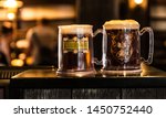 Small photo of Butterbeer at the Three Broomsticks. Delicious beverage imagined by JK Rowling. Shot at the Wizarding World of Harry Potter at Universal Studios Orlando, Florida. July 2019. Close up of the beer.