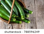 Fresh zucchini, green vegetables on local farmer market, freshly harvested courgette, summer squash
