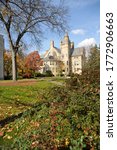 Small photo of OBERLIN/ USA - OCTOBER 31 2011: Autumn leaves fall to the ground nearby historic Peters Hall at Oberlin College and Conservatory.