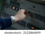 Small photo of SAHUARITA, ARIZONA - DECEMBER 3, 2013: An operator turns one of the two keys required to launch a Titan II Missile, inside Control Center Level 1, at the Titan Missile Museum.