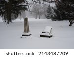 Small photo of OBERLIN, OHIO, USA - JANUARY 02, 2014: Gravestones in Westwood Cemetary on Morgan Street, during a snowstorm.