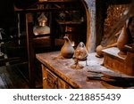 Small photo of Prague, Czech Republic, 2 October 2022: Museum of Alchemists and Magicians, flasks, retorts and other chemical glassware and equipment for experiments in laboratory, Mystic manuscripts and herbs