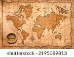 Small photo of World Map with compass and wooden airplane
