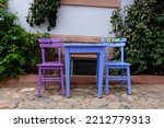 two colorful chairs and table. summer concept cafe