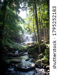 Small photo of Picture of Phusoidao waterfall in ther deep forest under morning raylight: Phu Soi Dao National Park, Uttaradit, Thailand