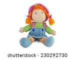 stuffed soft sitting funny pig-tailed red-headed doll isolated over white 