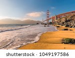 Golden Gate Bridge at sunset seen from beach, San Francisco, California.  