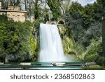 Small photo of Conceptual photo spring panoramic with waterfall in Isola del Liri medieval village in central Italy in Europe. Historical tourist destination. Water flowers within a colorful country full of joy