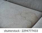 Small photo of Dirty, stain, blot , fleck of water on the fabric, textile sofa. Dirty textile sofa chemical cleaning Dirty textile sofa chemical cleaning. upholstered furniture cleaning concept