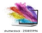 Laptop with color splash isolated on white background
