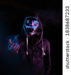 Small photo of man with the purge mask on black background