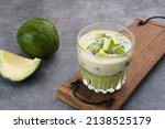 Small photo of Avocado Milk Cheese Dessert is made from avocado, jelly, cheese, basil seeds, sweetened condensed milk and evaporated milk. Served in a glass. Space for text