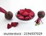 Fresh Organic Beetroot Slices served in a bowl on a white background. This fruit is usually made into juice or salad.
