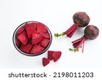 Fresh Organic Beetroot Slices served in a bowl on a white background. This fruit is usually made into juice or salad.
