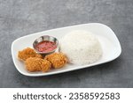 Small photo of Crispy dory fillets (Ikan dori goreng tepung) with chilli sauce