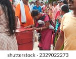Small photo of Mahesh, 06-28-2023: women devotees bowing their head to the structure of chariot as they prey to Lord Jagannath, before the start of Ulta Rath festival at Gundicha Bari temple.