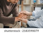 Small photo of Hands of medical personnel comforting to reassure the patient in clinic, Healthcare and medical concept.