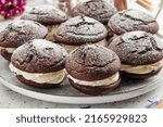 Small photo of Closeup on sweet chocolate creamy whoopie pies