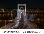 Small photo of White and red light trails of cars on Elisabeth bridge over Danube at night Budapest Hungary Europe