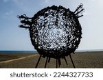 Small photo of Gran Tarajal, 10-24-2022, Virtuous circles sphere in front of the sea